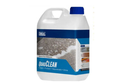A large white bottle of floor cleaner called quad clean with a blue logo