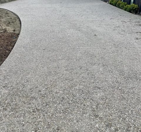 Bush hammer outdoor driveway NZ Grinders Tauranga before
