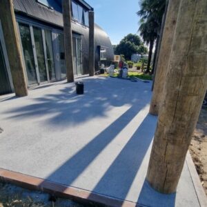 nz griinders outdoor finish bush hammer grind king peter fell exposed aggregate Bush hammer outdoor patio NZ Grinders Tauranga