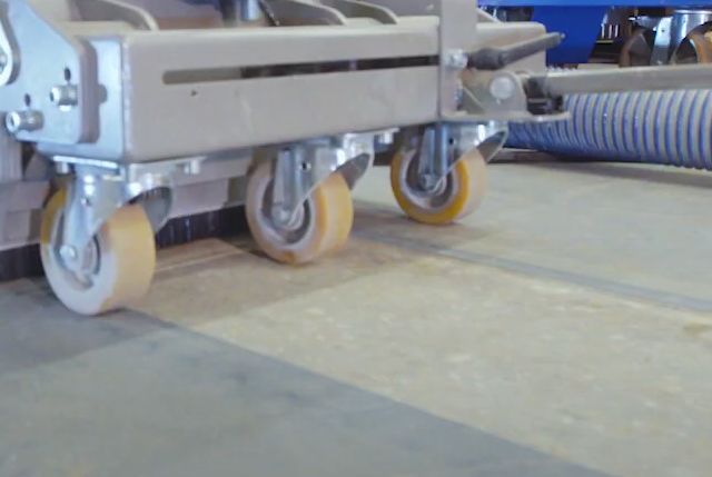 close up image of a floor under a concrete chase cutter with a 8mm channel cut into the concrete 20cm wide