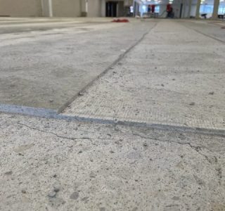 close up of concrete floor with 2 levels of cut in a channel - 6mm and 15 mm deep