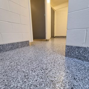 Flake flooring at the historic village toilets tauranga with coving up the walls