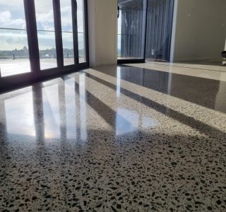 NZ Grinders polished concrete floor full aggregate exposure in lounge area
