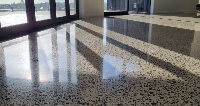 NZ Grinders polished concrete floor full aggregate exposure in lounge area