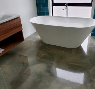 Residential bathroom with polished concrete floor NZ Grinders