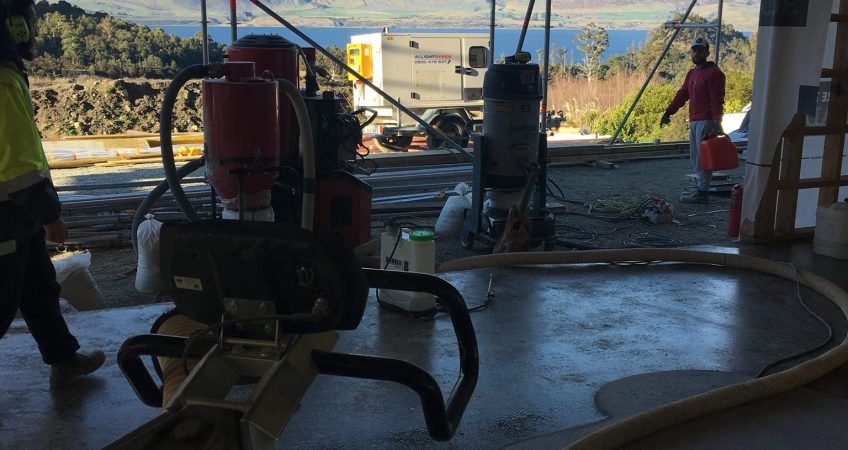Polished concrete floor in progress with machines Queenstown