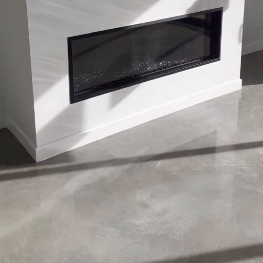 Marble Exposure polished concrete NZ Grinders Warehouse Tauranga Lounge fireplace