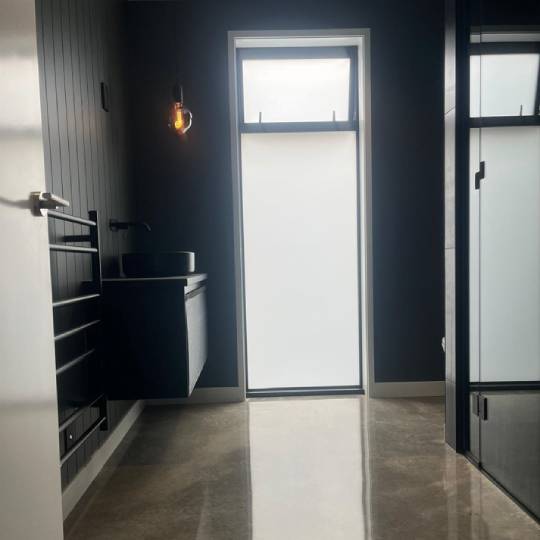 Marble Exposure polished concrete NZ Grinders Warehouse Tauranga bathroom