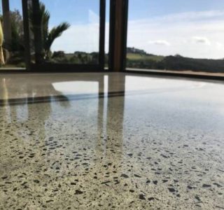 concrete floor with exposed stone