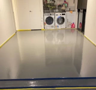 Laundry in garage with epoxy floor