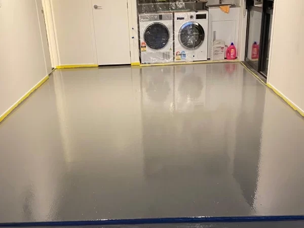 Laundry in garage with epoxy floor