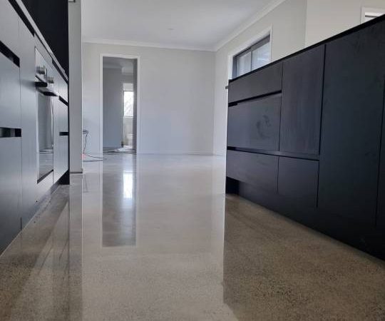 Salt and pepper finish for a beach house polished concrete floor nz grinders tauranga kitchen