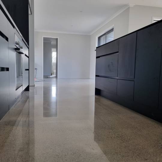 Salt and pepper finish for a beach house polished concrete floor nz grinders tauranga kitchen