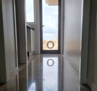 Salt and pepper finish for a beach house polished concrete floor nz grinders tauranga hallway