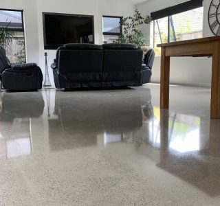 Salt and pepper finish for a beach house polished concrete floor nz grinders tauranga living room