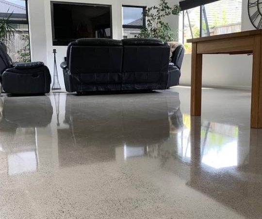 Salt and pepper finish for a beach house polished concrete floor nz grinders tauranga living room