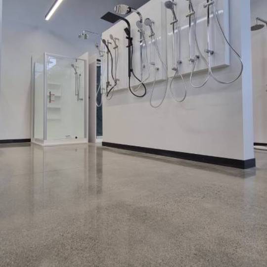 Salt and pepper finish for a beach house polished concrete floor nz grinders tauranga showroom