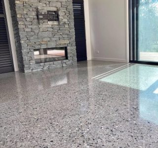 Polished concrete floor in front of fireplace Wellington