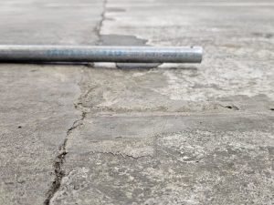 Damaged concrete floor before