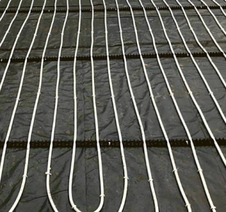 Underfloor heating coil on floor polished concrete